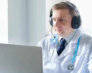 doctor-in-headset-speaks-talks-to-patient-telehealth-telemedicine-online-consultation-video-cal-1024x682-1.webp